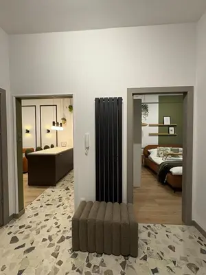 a room with two beds and a couch in it at City Heaven Bonarka Kraków in Kraków