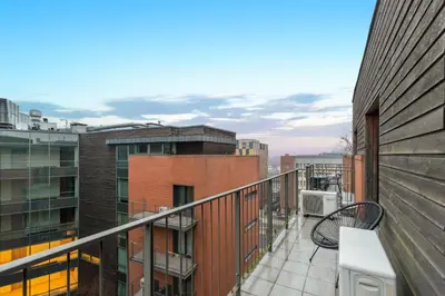 an apartment balcony with a view of the city at Apartament Old Town Comfort Balkon & Parking in Kraków