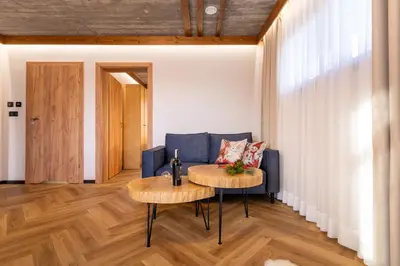a living room with a couch and a table at Olesiówka in Nowy Targ