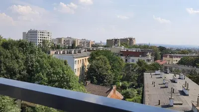 a view of a city with buildings and trees at Modern studio on Wrocławska with balcony in Kraków