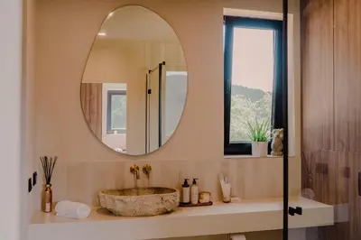 a bathroom with a sink and a mirror at Vidok House