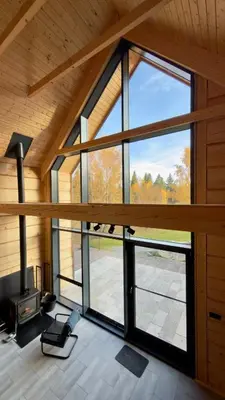 a room with a large window in a house at MC Na Leśnej Polanie in Szczawa