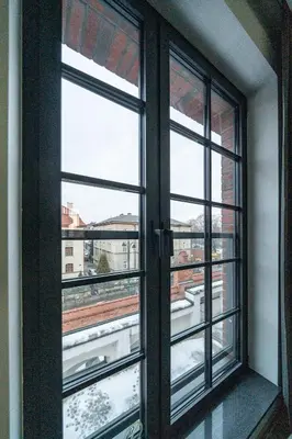 an open window with a view of a city at Lubicz Boutique Apartment - Old Town Area in Kraków