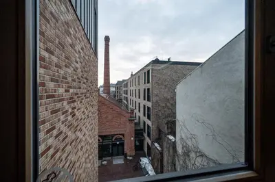 a view from a window of a brick building at Lubicz Boutique Apartment - Old Town Area in Kraków