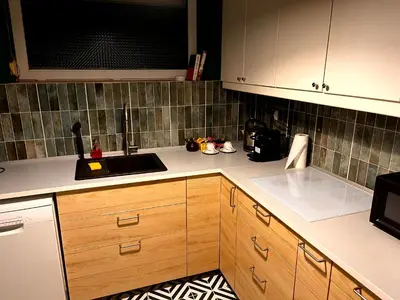 a kitchen with a sink and a counter top at Blue Apartment KRK with Balcony in Kraków