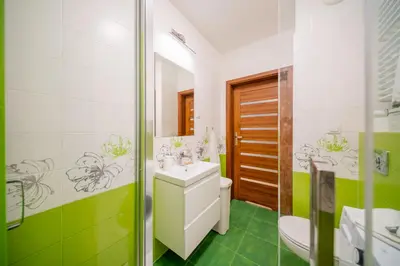 a bathroom with a sink and a toilet at Tauron Arena - Parking, Balcony, AirCon - by Rentujemy in Kraków