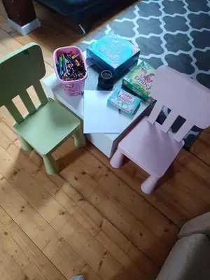 a coffee table with two chairs and toys on it at Paula Apart in Wadowice