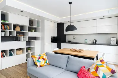 a living room with a couch and a table at Bulwar Kurlandzki Downtown Apartment by BookingHost in Kraków