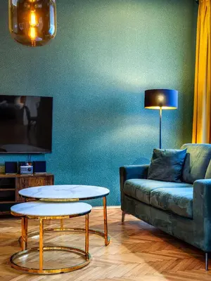 a living room with a couch and a table at Royal Vistula Luxury Apartment in Kraków