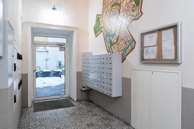 a hallway with a door leading to a room at Bosacka Downtown Apartment by BookingHost in Kraków