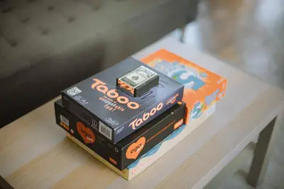 a stack of boxes with a alarm clock on top at Kraków Modern Apartment | 6 Guests, Parking/Tram in Kraków