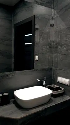 a bathroom with a large white sink on a counter at Domki Leśne Zacisze in Baczyn