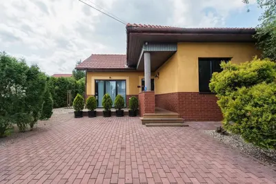 a house with a brick driveway in front of it at MAWKA near Enerdgylandia in Zator