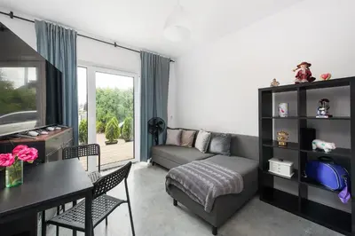 a living room with a couch and a table at MAWKA near Enerdgylandia in Zator