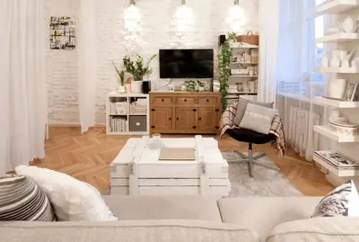 a living room with a couch and a tv at MAGICAL apartment in Kraków