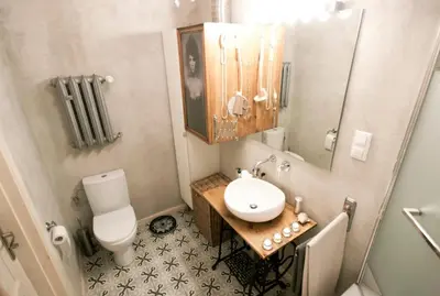 a small bathroom with a toilet and a sink at MAGICAL apartment in Kraków