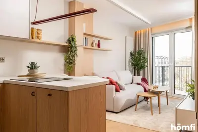 a room with white cabinets and a hallway at Winewood Apartment - homfi Collection in Kraków