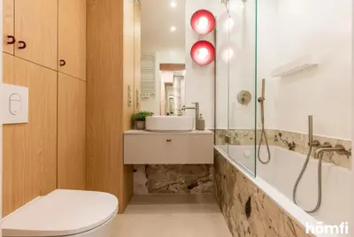 a bathroom with a toilet and a sink at Winewood Apartment - homfi Collection in Kraków