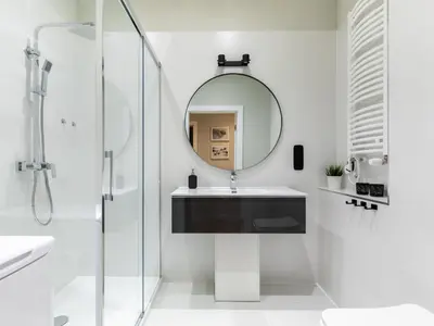 a bathroom with a sink and a mirror at Pink Boutique Apartment 60m2 & Garage in Kraków
