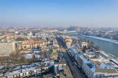 an aerial view of a city with a river and buildings at Kościuszki Apartment N1 - AirCon - by Rentujemy in Kraków