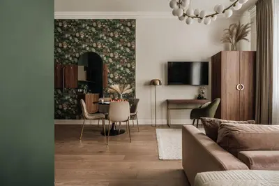 a living room with a couch and a table with chairs at White Lotus by Fragola Apartments in Kraków