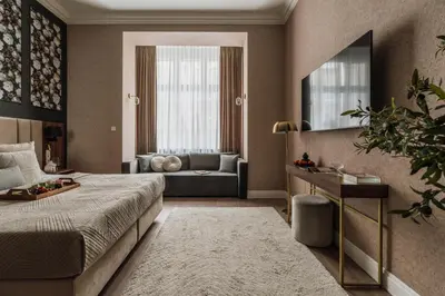 a hotel room with a bed and a couch at White Lotus by Fragola Apartments in Kraków
