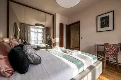a bedroom with a large bed in a room at Boho13 Apartment by Cracovia Prime in Kraków