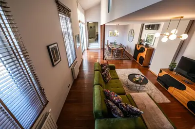 a living room with a couch and a table at Boho13 Apartment by Cracovia Prime in Kraków