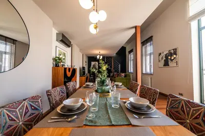 a dining room with a table and chairs at Boho13 Apartment by Cracovia Prime in Kraków