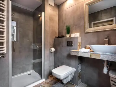 a bathroom with a toilet and a sink and a shower at Boho and Forest Studios by Tyzenhauz in Kraków