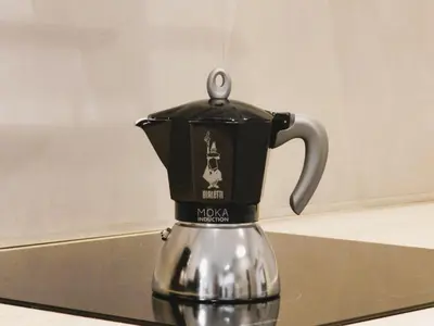 a black and silver coffee pot sitting on a counter at Apartament Donnka in Kraków