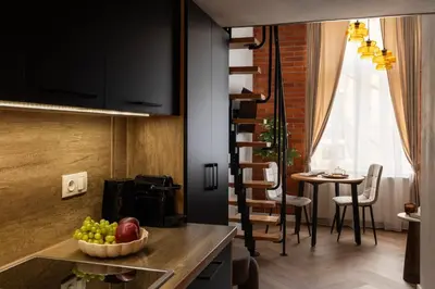 a kitchen with a bowl of fruit on a counter at L23 Boutique by Downtown Apartments in Kraków