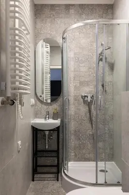 a bathroom with a shower and a sink at L23 Boutique by Downtown Apartments in Kraków
