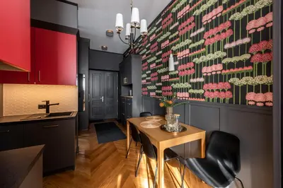 a bedroom with a bed with a painting on the wall at Amaryllis Apartment by MB Apartments in Kraków