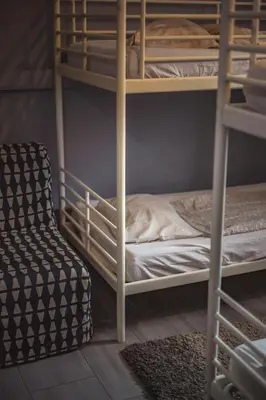 a couple of bunk beds in a room at 4 Couples Hostel in Kraków