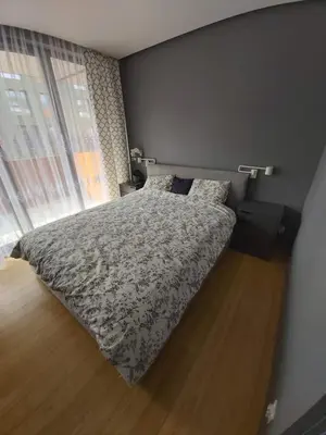 a bedroom with a bed and a window at Urban Oasis with a garage in Kraków