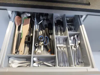 a drawer full of utensils in a drawer at Urban Oasis with a garage in Kraków