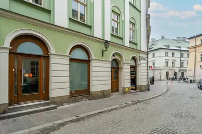 a building on the side of a street at Heart of Cracow Old Town Apartment by BookingHost in Kraków