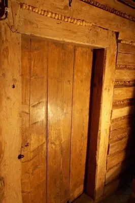 an open wooden door in a wooden cabin at Holiday Home mit Wasserblick by Interhome in Kraków