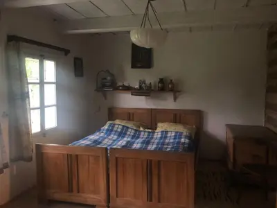 a bedroom with a bed in a room with a window at Holiday Home mit Wasserblick by Interhome in Kraków
