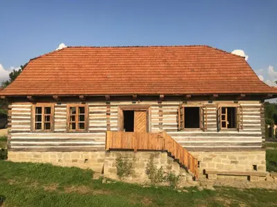 an old wooden house with a red roof at Holiday Home mit Wasserblick by Interhome in Zawada