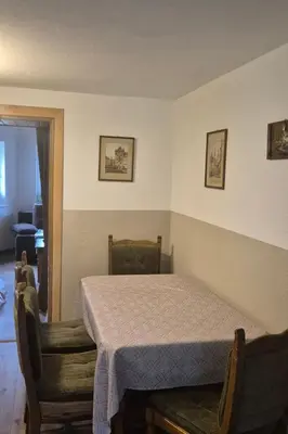 a bedroom with a table and two chairs and a table at Holiday Home Haus Sonne by Interhome in Nowe Rybie