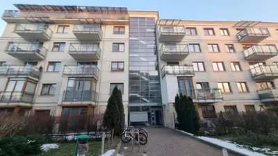 a building with bikes parked in front of it at Apartment Cure in Kraków