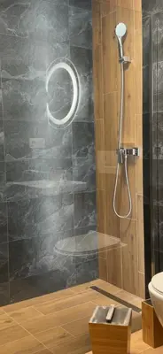 a bathroom with a shower with a toilet and a sink at Babiogórski Azyl & SPA in Zawoja
