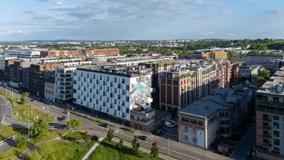 an aerial view of a city with tall buildings at Zabłocie Harmony Apartment by BookingHost in Kraków