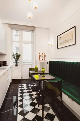 a living room with a green couch and a table at QUEEN #2 APARTMENT, WAWEL VIEW, OLD TOWN, Kraków in Kraków