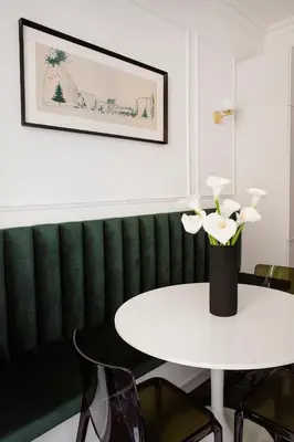 a white table with a vase of flowers on it at QUEEN #2 APARTMENT, WAWEL VIEW, OLD TOWN, Kraków in Kraków