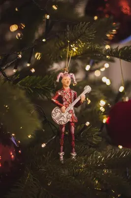 a ornament of a elf with a guitar on a christmas tree at QUEEN #2 APARTMENT, WAWEL VIEW, OLD TOWN, Kraków in Kraków