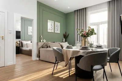 a kitchen and dining room with a table and chairs at Perfect Apartment in the Old Town 5min Market Square AC WiFi Parking in Kraków