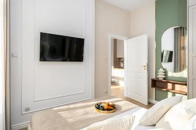 a living room with a couch and a table at Perfect Apartment in the Old Town 5min Market Square AC WiFi Parking in Kraków